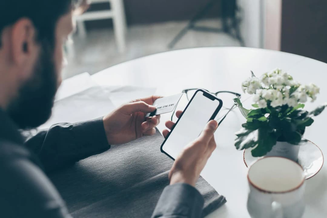 Mobile banking app on smartphone with credit card