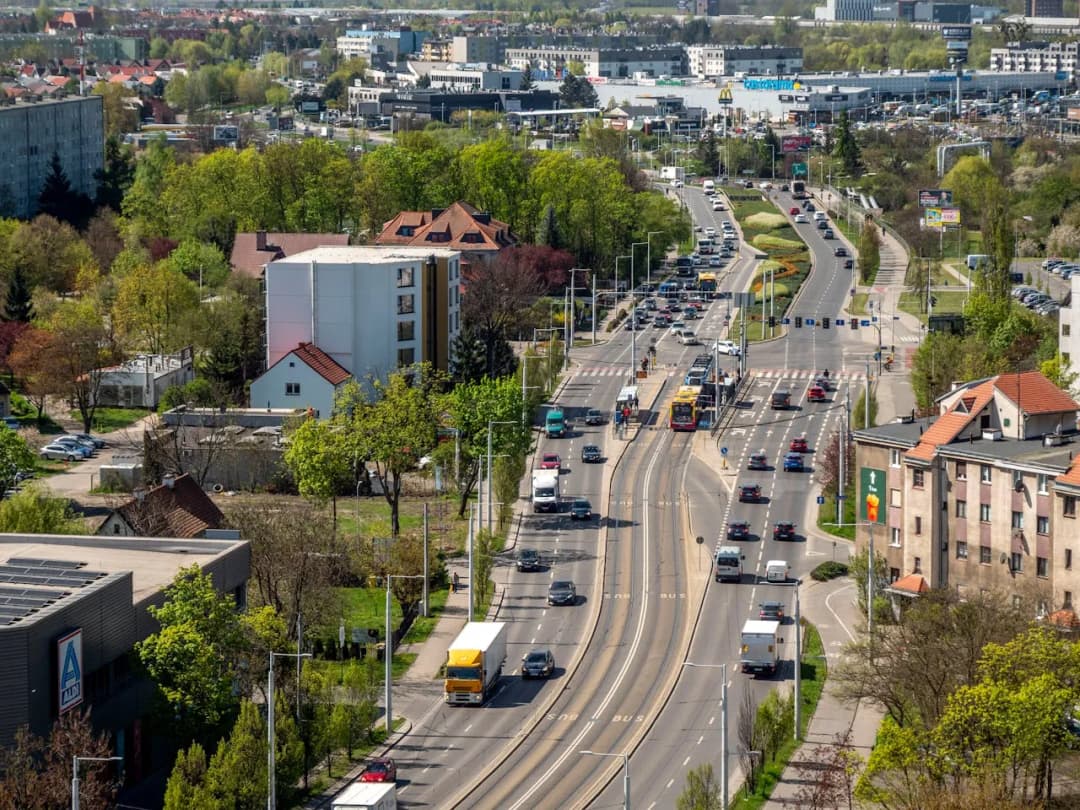 Traffic on a Polish city road with tram tracks